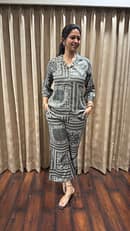 Deep charcoal base  Lightweight soft crepe blend with straight cut pants