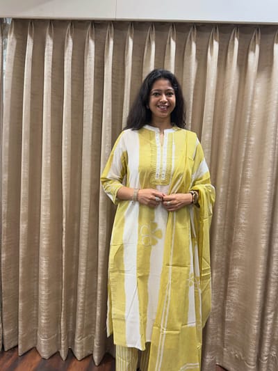 Light lemon soft bretheable cotton for everyday wear with slit delicate thread & mirror work placket.matching striped dupatta
